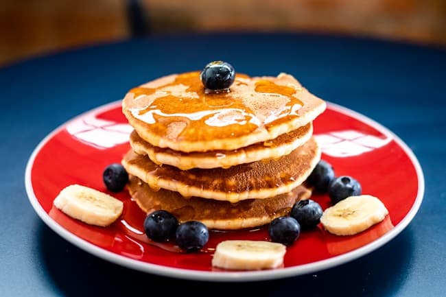 Freshly prepared breakfast with fruit and pancakes